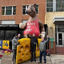 A large inflatable rat displayed near a labor protest