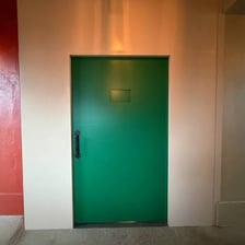 A discreet entrance to a bar, illustrating the idea of a password-protected speakeasy.