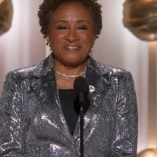 Wanda Sykes performing on a comedy stage.
