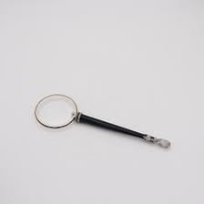 A monocle with one round lens