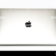 The bitten-apple Apple logo displayed on a Macintosh computer