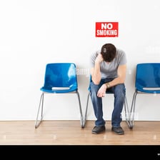 A person staying seated while waiting