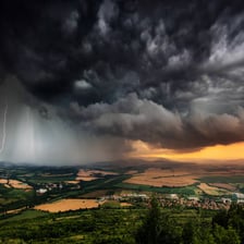 A landscape under an intense, threatening storm.