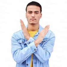 A person making a clear gesture of refusal.