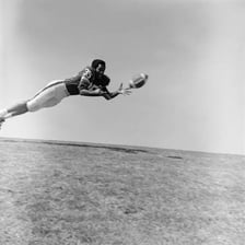A person catching an object in midair