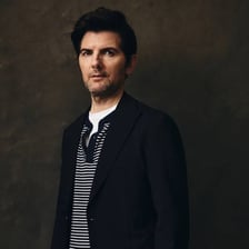 A portrait of actor Adam Scott.