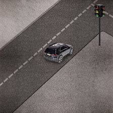 A car approaching a red traffic light