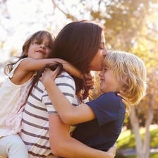 A parent caring for and raising children.