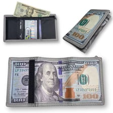 Paper money arranged beside a wallet.