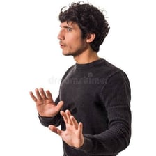 A person gesturing for someone to wait before receiving an explanation