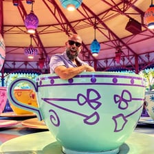 Colorful teacup vehicles on the Mad Tea Party spinning ride.