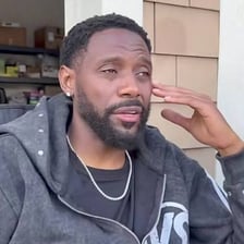 A person making a hand gesture telling someone to leave.