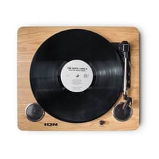 A vinyl LP record resting on a turntable.