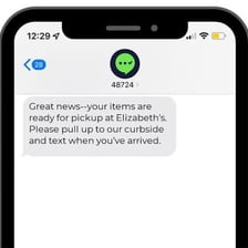 A smartphone displaying a message asking when someone will arrive for a pickup