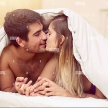 A couple sharing a brief kiss