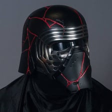Kylo Ren wearing his distinctive black helmet in Star Wars.