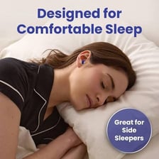 Foam earplugs placed beside a sleeping person.