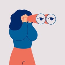 A person studies an object with a focused gaze.