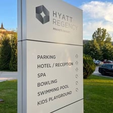 The exterior of a Hyatt hotel with its brand signage