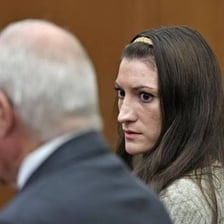 A person visibly denying an accusation