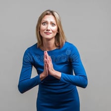 A person making an earnest pleading gesture