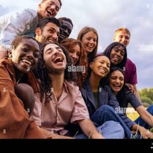A group of friends standing together and smiling