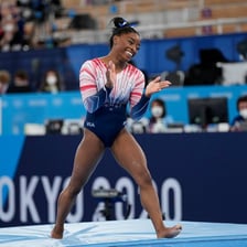 Simone Biles performing a gymnastics routine
