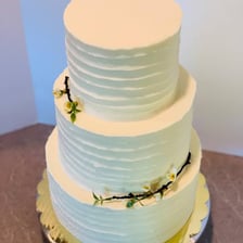 A tiered wedding cake with visible layers