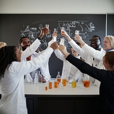 A group of scientists celebrating a successful discovery