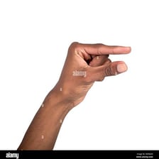 A person gently nudging an object with a finger.