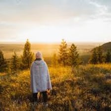 Person standing alone in a natural landscape