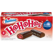 A Hostess Ho Hos chocolate snack cake showing its rolled swirl.
