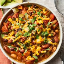 A bowl of vegetarian chili containing beans