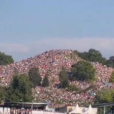 A large crowd attending a Taylor Swift Eras Tour concert.
