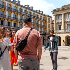 Sightseers following a guide on a walking tour