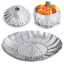 A metal steamer basket holding vegetables over boiling water