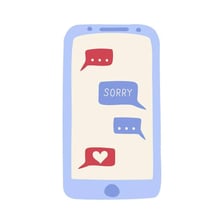 A phone displaying an informal apology text message.