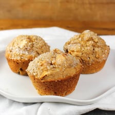 An apple bran muffin on a plate