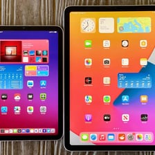 An Apple iPad displayed beside a smaller iPad mini