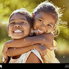 Two sisters posing together in a family photograph