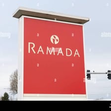 A Ramada hotel building with its brand sign