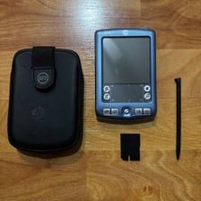 A vintage Palm personal digital assistant handheld device