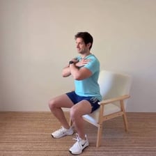 A person seated after previously standing.