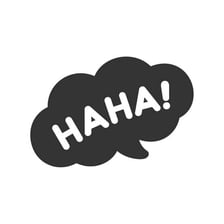 A phone screen displaying a casual laughing text message.