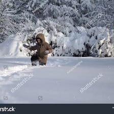 A person walking heavily through deep snow.