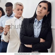 A frustrated person waiting in a long line