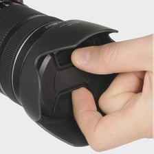 A removable cap covering the front of a camera lens.