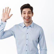 A person waving in greeting