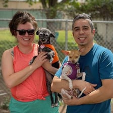 A family celebrating an adopted dog’s adoption anniversary