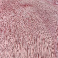 A close-up of synthetic faux-fur fabric.